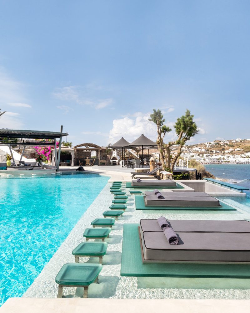 Main-pool-with-sunbeds-in-water-F